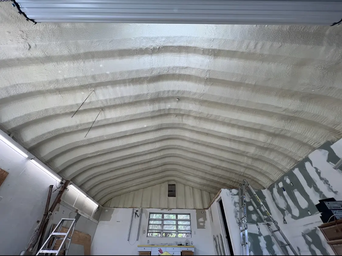 Spray polyurethane foam applied to the underside of a metal roof deck in Sheridan